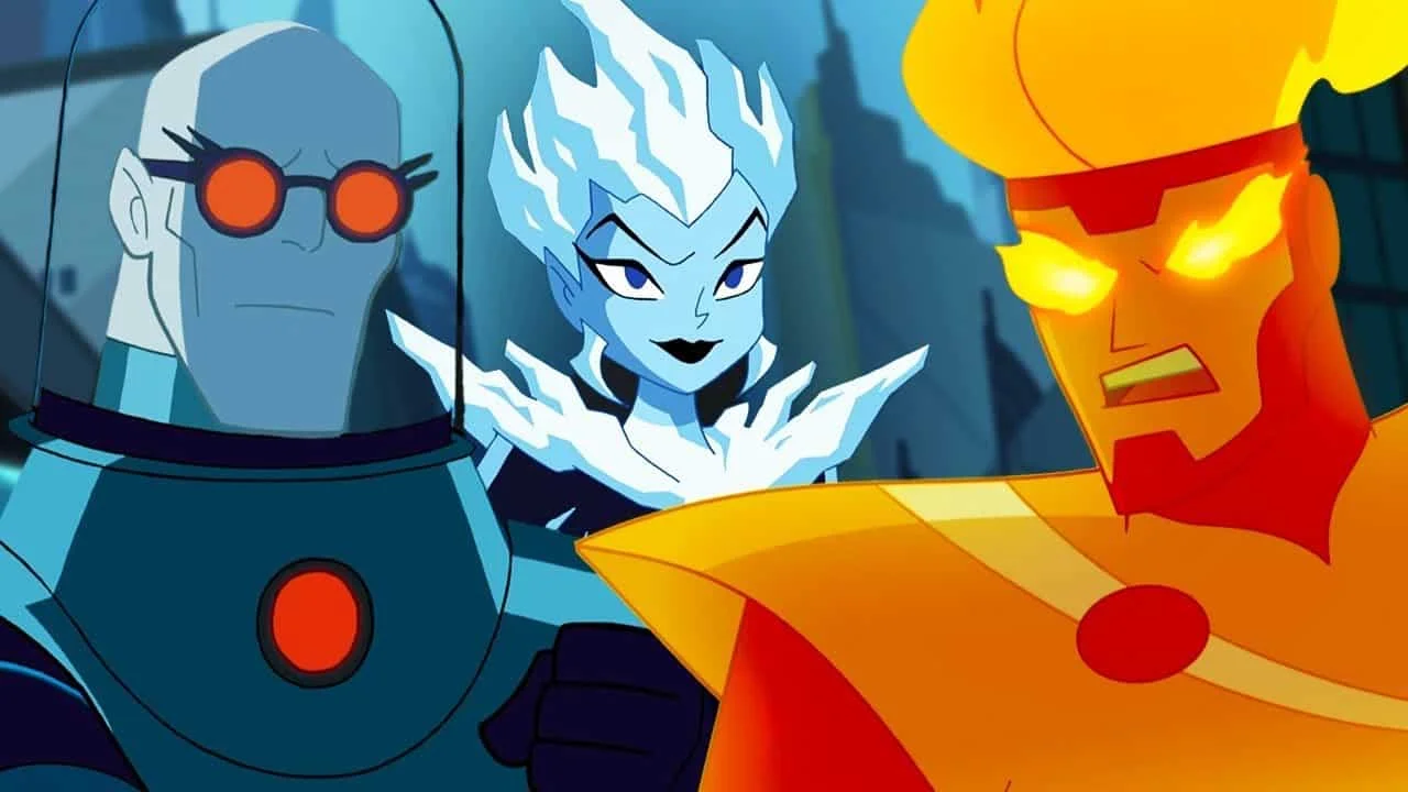 Three animated superheroes posing together: a blue ice-wielding figure in the center, an orange-glass-eyed armored hero on the right, and a blue-toned robot on the left, in a city backdrop.